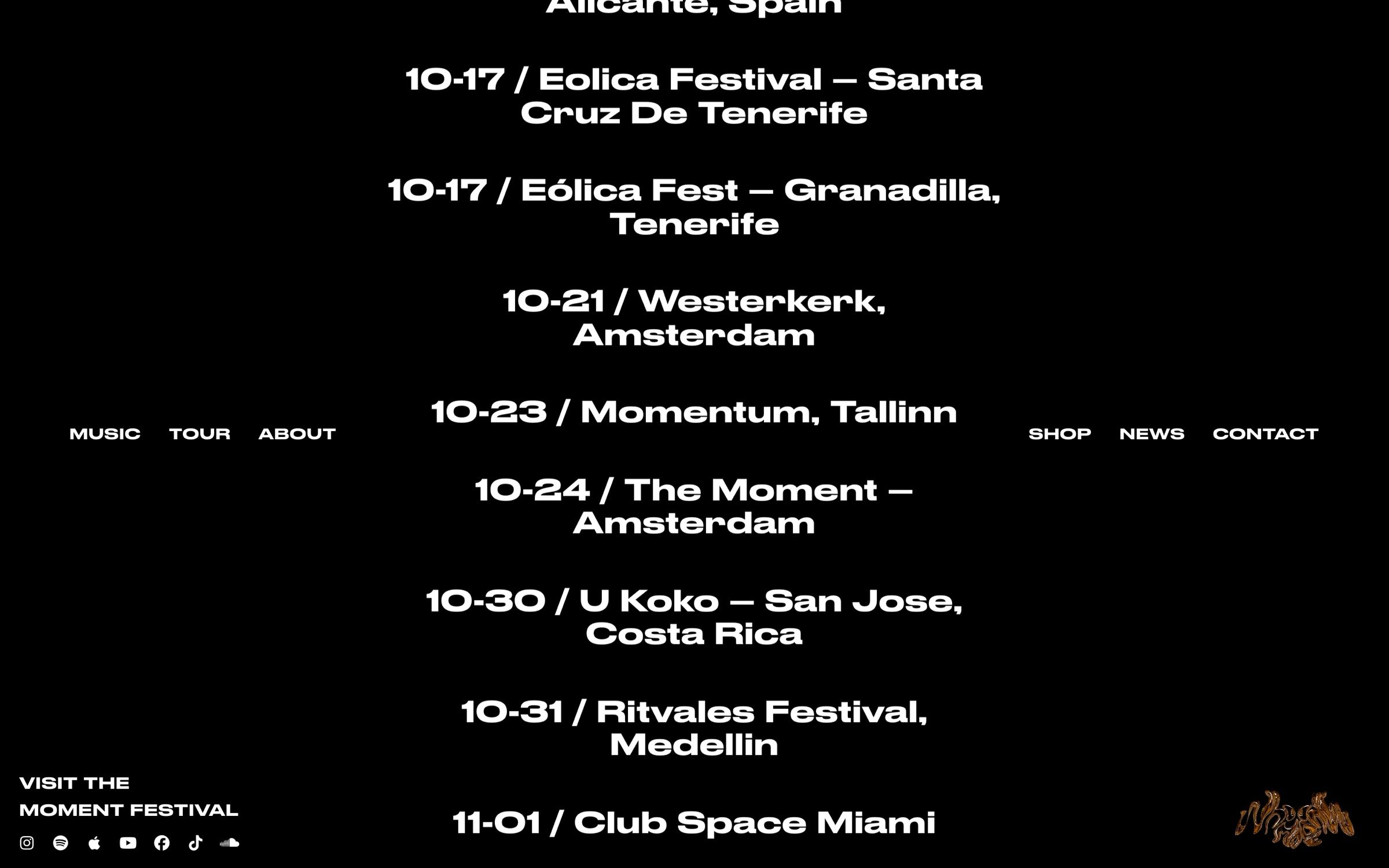 The WhoMadeWho home page on desktop, tour dates running in bold white type on black with the menu split left and right