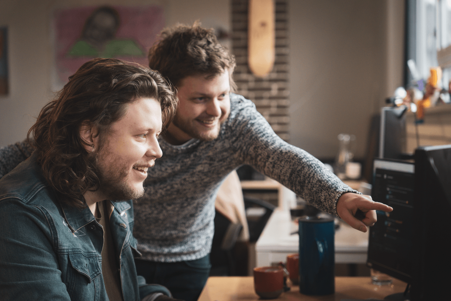 2 people working on a computer